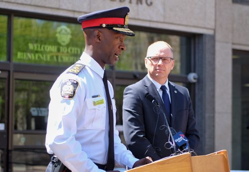 Winnipeg Police Chief Devon Clunis and Winnipeg City Councillor Scott Gillingham, Chair of the Winnipeg Police Board, announce the 2015-2019 Winnipeg Police Service Strategic Plan outside City Hall Tuesday afternoon.  150519 May 19, 2015 Mike Deal / Winnipeg Free Press