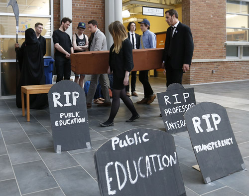 About 50 students and staff held a rally with a mock funeral including the grim reaper in the engineering atrium at University of Manitoba Tuesday against budget cuts just before the board of governors met. ¤ Nick Martin story¤ Wayne Glowacki / Winnipeg Free Press May 19 2015