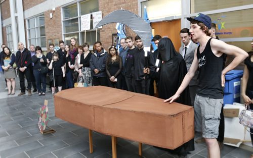 About 50 students and staff held a rally with a mock funeral including the grim reaper in the engineering atrium at University of Manitoba Tuesday against budget cuts just before the board of governors met. At right, Mitchell van Ineveld representing the Canadian Federation of Students, Manitoba Branch speaks at the mock funeral.¤ Nick Martin story¤ Wayne Glowacki / Winnipeg Free Press May 19 2015