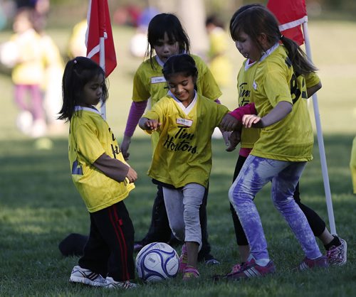 May 19, 2015 - 150519  -  Supanpreet Chohon (c) takes part in a soccer program that encourages participation by inner-city girls Tuesday, May 19, 2015. John Woods / Winnipeg Free Press