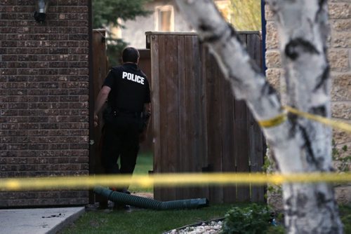 May 19, 2015 - 150519  -  Police were on the scene at 9 Cheltenham Cove, the scene of Winnipeg's latest homicide, Tuesday, May 19, 2015. John Woods / Winnipeg Free Press