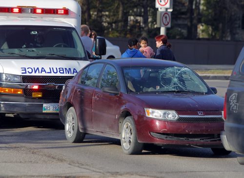 NEWS MVC pedestrian at Grant Ave.and Roblin Blvd. at around 7:30am. In photo is the people from the car that has windshield impact evidence. BORIS MINKEVICH/WINNIPEG FREE PRESS May 20, 2015