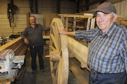 08 - Leonard Pappel, forground, and Paul Barnabe, of Emerson, and their Red River Oxcart. It was built from scratch, including harvesting and milling trees for the wood, in six weeks. BILL REDEKOP/WINNIPEG FREE PRESS May 15, 2015