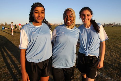 The Immigrant and Refugee Community Organization of Manitoba "IRCOM" Cobras under-16 girls soccer team playing the West St. Paul Stars U-16 team Wednesday evening. (l-r) Nasra, Noela, and Falanga. 150520 - Wednesday, May 20, 2015 -  (MIKE DEAL / WINNIPEG FREE PRESS)