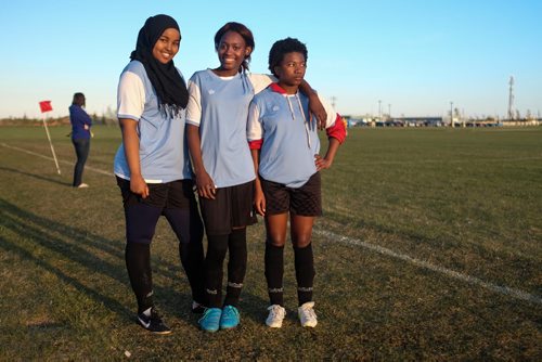 The Immigrant and Refugee Community Organization of Manitoba "IRCOM" Cobras under-16 girls soccer team playing the West St. Paul Stars U-16 team Wednesday evening. (l-r) Milko, Attio, and Dima. 150520 - Wednesday, May 20, 2015 -  (MIKE DEAL / WINNIPEG FREE PRESS)