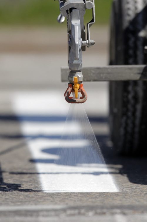 49.8 - Road lines being painted by a City of Winnipeg crews on University Crescent near the stadium. BORIS MINKEVICH/WINNIPEG FREE PRESS May 21, 2015