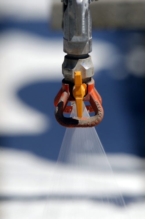 49.8 - Road lines being painted by a City of Winnipeg crews on University Crescent near the stadium. BORIS MINKEVICH/WINNIPEG FREE PRESS May 21, 2015