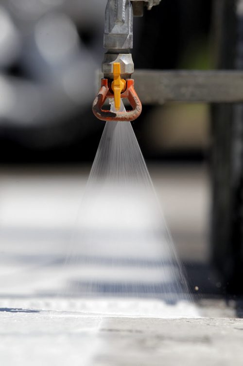 49.8 - Road lines being painted by a City of Winnipeg crews on University Crescent near the stadium. BORIS MINKEVICH/WINNIPEG FREE PRESS May 21, 2015