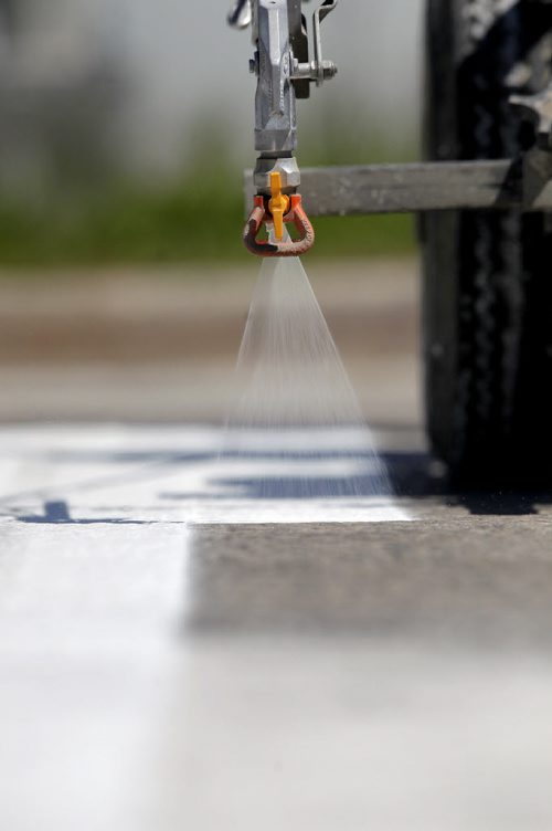 49.8 - Road lines being painted by a City of Winnipeg crews on University Crescent near the stadium. BORIS MINKEVICH/WINNIPEG FREE PRESS May 21, 2015