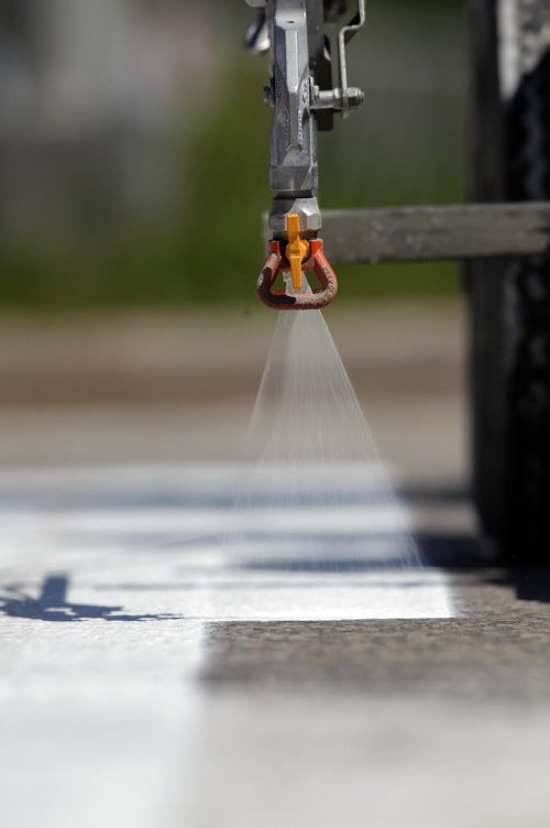 49.8 - Road lines being painted by a City of Winnipeg crews on University Crescent near the stadium. BORIS MINKEVICH/WINNIPEG FREE PRESS May 21, 2015