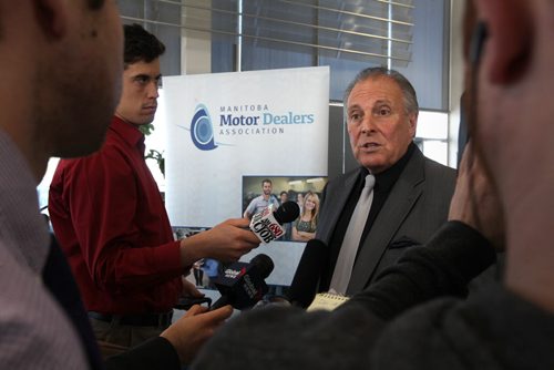 Consumer Protection Minister Ron Lemieux talks to the media about the new advertising rules that will be put into place as of June 1st to help protect buyers at Birchwood Toyota, Pointe West Auto Park Thursday.  See Bruce Owen's story.    May 21, 2015 Ruth Bonneville / Winnipeg Free Press