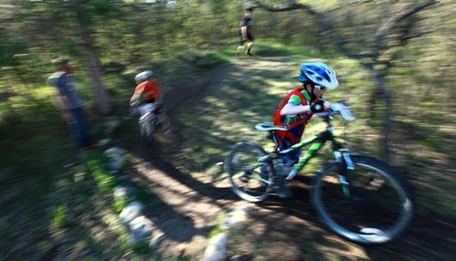 PHOTO FEATURE - Young riders in the "kids" portion, negotiate a technical turn at the Wednesday evening mountain bike races at Birds Hill Bird's Hill Park. May 20, 2015 - (Phil Hossack / Winnipeg Free Press)