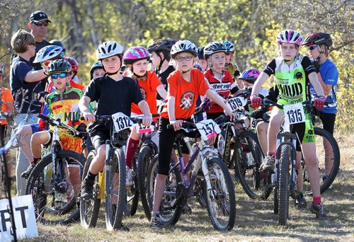 PHOTO FEATURE - Young riders line up for the start of their heats in the "kids" portion of the Wednesday evening mountain bike races at Birds Hill Bird's Hill Park. May 20, 2015 - (Phil Hossack / Winnipeg Free Press)