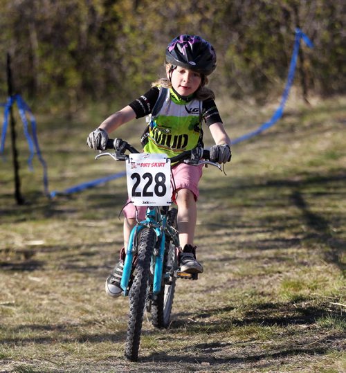 PHOTO FEATURE - A young rider hits the trail in the "kids" portion of the Wednesday evening mountain bike races at Birds Hill Bird's Hill Park. May 20, 2015 - (Phil Hossack / Winnipeg Free Press)
