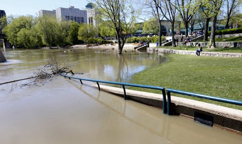Water levels on the Assiniboine River have risen over the Riverwalk at The Forks. Geoff Kirbyson story   Wayne Glowacki / Winnipeg Free Press May 21 2015