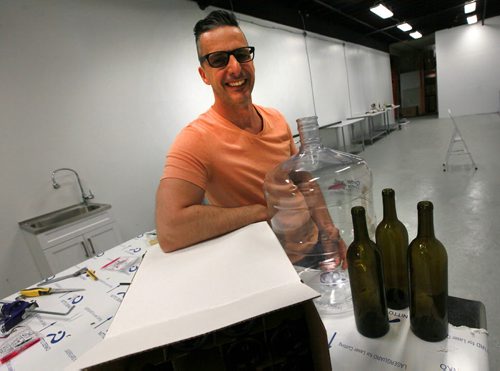 Sandro Foianesi, owner of Brewers Direct poses in an area of his retail outlet he is renovating for customers to brew their own wine and beer on site. See Kirbyson story. May 21, 2015 - (Phil Hossack / Winnipeg Free Press)