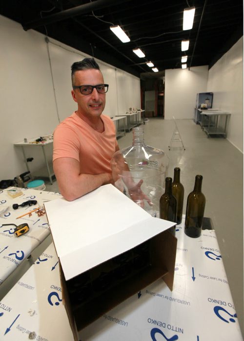 Sandro Foianesi, owner of Brewers Direct poses in an area of his retail outlet he is renovating for customers to brew their own wine and beer on site. See Kirbyson story. May 21, 2015 - (Phil Hossack / Winnipeg Free Press)