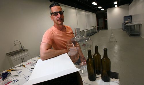 Sandro Foianesi, owner of Brewers Direct poses in an area of his retail outlet he is renovating for customers to brew their own wine and beer on site. See Kirbyson story. May 21, 2015 - (Phil Hossack / Winnipeg Free Press)