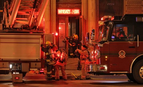 Winnipeg Fire Department crews work on putting out a fire at Whisky Dix on Main Street.  150521 May 21, 2015 Mike Deal / Winnipeg Free Press