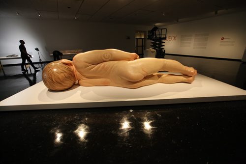 Views of Ron Mueck's exhibit of a newborn baby  titled "A Girl",   which is startlingly large yet very life-like at the WAG Friday.  Mueck is a UK-based Austrailian artist that creates realistic yet enigmatic sculptures that portray humans at key stages in life, from birth through middle age, to death.  The works are either monumental in scale or undersized.    May 22, 2015 Ruth Bonneville / Winnipeg Free Press