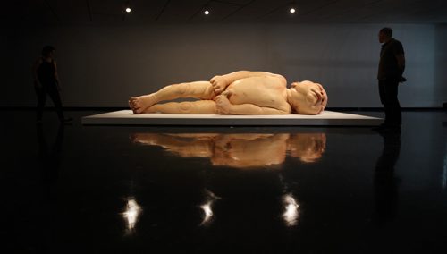 Views of Ron Mueck's exhibit of a newborn baby  titled "A Girl",  which is startlingly large yet very life-like at the WAG Friday.  Mueck is a UK-based Austrailian artist that creates realistic yet enigmatic sculptures that portray humans at key stages in life, from birth through middle age, to death.  The works are either monumental in scale or undersized.    May 22, 2015 Ruth Bonneville / Winnipeg Free Press