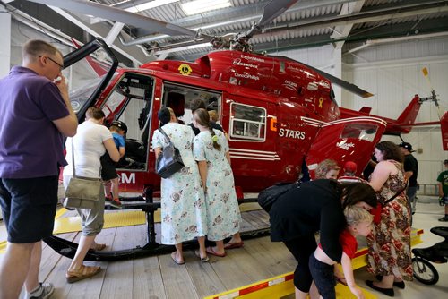 Visitors, pilots and nurses at the STARS hanger, Saturday, May 23, 2015. (TREVOR HAGAN/WINNIPEG FREE PRESS)