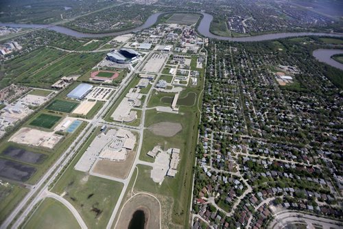 The Red River, Investors Group Field, Chancellor Matheson Road, Innovation Drive, University of Manitoba and part of Fort Richmond, seen from the STARS air ambulance, Saturday, May 23, 2015. (TREVOR HAGAN/WINNIPEG FREE PRESS)