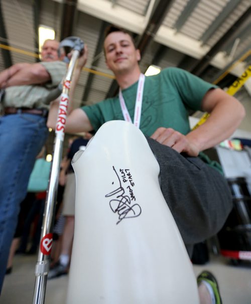 STARS air ambulance pilot Jason Graveline, signed the prosthetic leg of Paul Neufeld, who lost his leg in a head on collision in November of 2012. Graveline was involved in the air call that day. Saturday, May 23, 2015. (TREVOR HAGAN/WINNIPEG FREE PRESS)