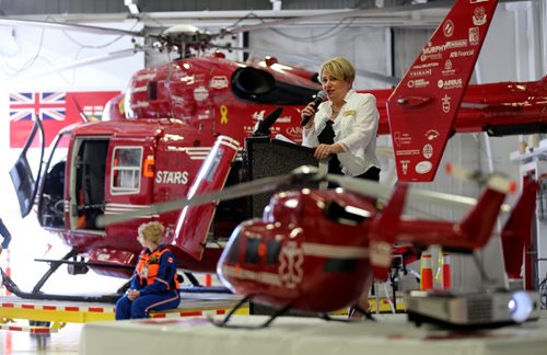 STARS CEO, Andrea Robertson speaking in front of an air ambulance inside their base Saturday, May 23, 2015. (TREVOR HAGAN/WINNIPEG FREE PRESS)