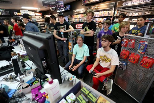 People crowd into PNP Games on Portage Avenue for a Super Smash Bros. tournament, Sunday, May 24, 2015. (TREVOR HAGAN/WINNIPEG FREE PRESS)