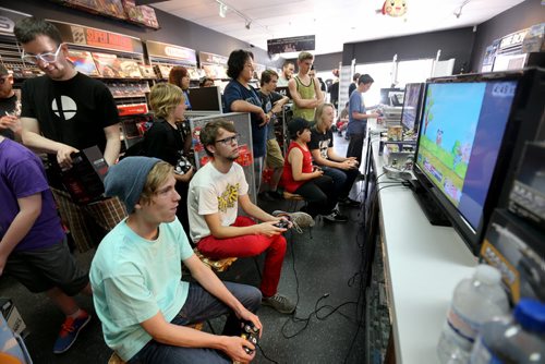 People crowd into PNP Games on Portage Avenue for a Super Smash Bros. tournament, Sunday, May 24, 2015. (TREVOR HAGAN/WINNIPEG FREE PRESS)