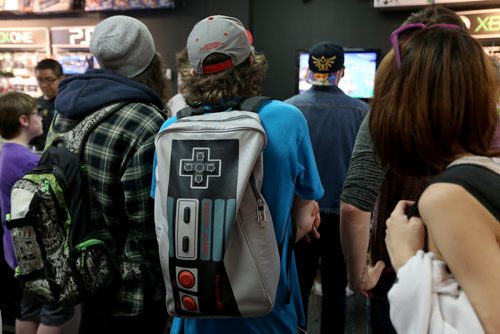 People crowd into PNP Games on Portage Avenue for a Super Smash Bros. tournament, Sunday, May 24, 2015. (TREVOR HAGAN/WINNIPEG FREE PRESS)