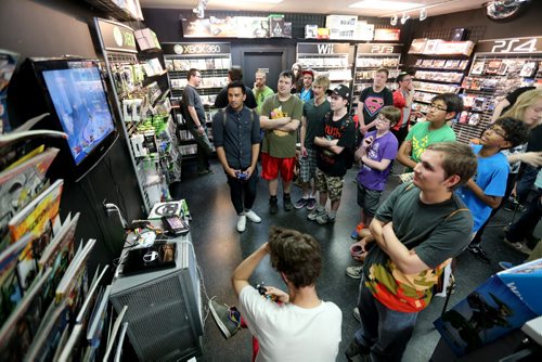 People crowd into PNP Games on Portage Avenue for a Super Smash Bros. tournament, Sunday, May 24, 2015. (TREVOR HAGAN/WINNIPEG FREE PRESS)