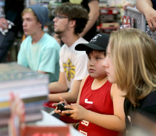 Jeff Murdock, 8, playing in a Super Smash Bros. tournament at PNP Games on Portage Avenue, Sunday, May 24, 2015. (TREVOR HAGAN/WINNIPEG FREE PRESS)