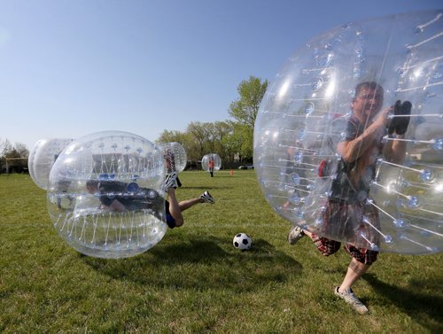 Players participate in Bubble Soccer. Neil Trudeau runs River City Bubble Ball, a company that organizes bubble soccer, Saturday, May 23, 2015. (TREVOR HAGAN/WINNIPEG FREE PRESS) - for dave sanderson intersection 49.9 piece