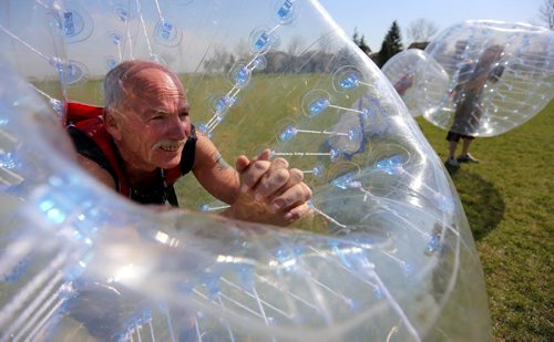 Neil Trudeau, left, runs River City Bubble Ball, a company that organizes bubble soccer, Saturday, May 23, 2015. (TREVOR HAGAN/WINNIPEG FREE PRESS) - for dave sanderson intersection 49.9 piece