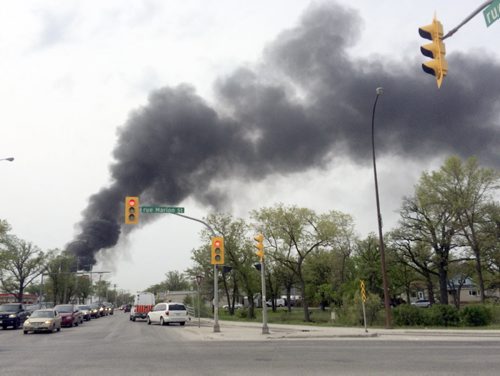 A man was badly injured from a explosion at Kens Carpets at 730 Archibald St Monday  approaching scene -Breaking News- May 25, 2015   (JOE BRYKSA / WINNIPEG FREE PRESS)