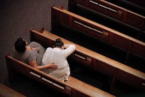 May 25, 2015 - 150525  -  A woman is comforted prior to a memorial service for Teresa Robinson. Friends and family came together to celebrate the life of Teresa Robinson at Calvary Temple Monday, May 25, 2015. John Woods / Winnipeg Free Press