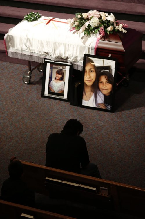 May 25, 2015 - 150525  -  A family friend sits before the casket of Teresa Robinson prior to a memorial service. Friends and family came together to celebrate the life of Teresa Robinson at Calvary Temple Monday, May 25, 2015. John Woods / Winnipeg Free Press