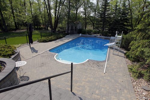 35 Stormont Drive in St. Norbert. Realtor Glen MacAngus listing.  Backyard swimming pool. BORIS MINKEVICH/WINNIPEG FREE PRESS May 26, 2015