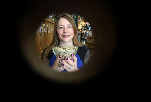 Preferred Perch, 1604 St Mary's Rd - owner Sherrie Versluis framed through a bird house for sale in her store- See Dave Sanderson- This City piece- May 26, 2015   (JOE BRYKSA / WINNIPEG FREE PRESS)