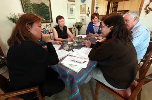 Left to right, Gulhiyaz (from Kazakstan) Halyna (from Ukraine) and Marina (from Siberia and Isreal) work around an apartment table with Barbara Cansino a volunteer ESL instructor. All these students are medical doctors brusing up their english to bring medical qualifications to Canadian standards. See Carol Sanders story. May 27, 2015 - (Phil Hossack / Winnipeg Free Press) CAROL HAS FULL NAMES.
