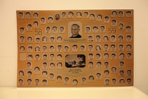 Class photo of the former Assiniboia Residential School at 611 Academy headed up by Rev Father O. Robidoux. Principal.  Theodore Fontaine, attends the former Assiniboine Residential School ( Assiniboia Residential School) at 611 Academy that he went to in the late 1950's, now it is, ironically, the Canadian Centre for Child Protection. Fontaine spends  time looking out the window of his former classroom and on the stairwell he climbed many times while attending the school. and perusing a archival class photo with him and his classmates  from 1958. See Catherine Mitchell story.   May 28, 2015 Ruth Bonneville / Winnipeg Free Press