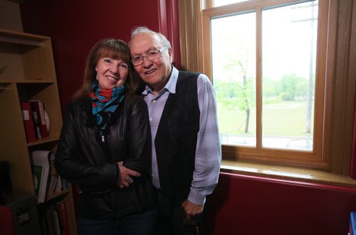 Theodore Fontaine with his wife Morgan next to window in his former classroom.  Theodore Fontaine, attends the former Assiniboine Residential School ( Assiniboia Residential School) at 611 Academy that he went to in the late 1950's, now it is, ironically, the Canadian Centre for Child Protection. Fontaine spends  time looking out the window of his former classroom and on the stairwell he climbed many times while attending the school. and perusing a archival class photo with him and his classmates  from 1958. See Catherine Mitchell story.   May 28, 2015 Ruth Bonneville / Winnipeg Free Press