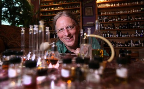 Michael O'Malley is all smiles as he blends essential oils in his home studio on Evanson st. Thursday after winning fight against City Hall to close his walk-in business down. See story.   May 28, 2015 Ruth Bonneville / Winnipeg Free Press