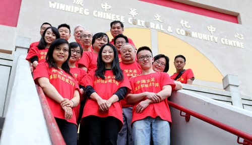 Members of the board of the Winnipeg Chinese Canadian Culrtural Centre wearing shirts they've made to support Team China in the upcoming FIFA Women's World Cup, Thursday, May 28, 2015. (TREVOR HAGAN/WINNIPEG FREE PRESS)