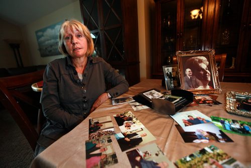 Sitting at her dining room table covered in snapshots, Joanne Rislund recalls memories good and bad about her father Frank ALexander an Alziemer's patient who was killed by another senior in a Winnipeg Nursing home.See Carol Sanders post enquiry story. May 28, 2015 - (Phil Hossack / Winnipeg Free Press)