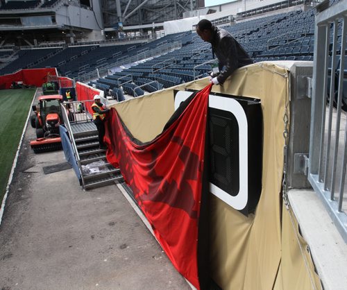 Installing banners on the field of Investors Group Field in preparation for FIFA Womens World Cup in Winnipeg-See Melissa Martin story- May 29, 2015   (JOE BRYKSA / WINNIPEG FREE PRESS)