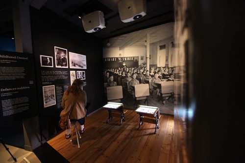 Museum goers examine the  Childhood Denied, Indian Residential Schools and their Legacy exhibit in the Canadian Journey's Gallery at the Canadian Museum for Human Rights.  See story on Truth and Reconciliation Conference report.   May 28, 2015 Ruth Bonneville / Winnipeg Free Press