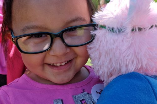 Olivia Manabat, 4, with her teddy bear at the Teddy Bears' Picnic at Assiniboine Park. The event brings around 30,000 people to the park, mostly kids with their stuffed toys that are damaged and need fixing. The money raised goes towards the Childrens Hospital Foundation of Manitoba.  150531 May 31, 2015 Mike Deal / Winnipeg Free Press